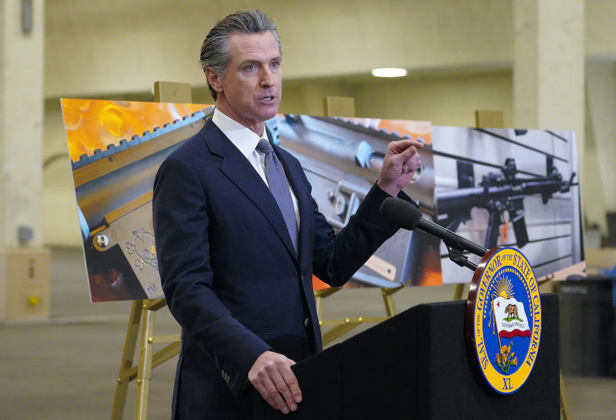 California Gov. Gavin Newsom speaks to reporters at Del Mar Fairgrounds in Del Mar, Calif., on Feb. 18, 2022. (Nelvin C. Cepeda/The San Diego Union-Tribune via AP)