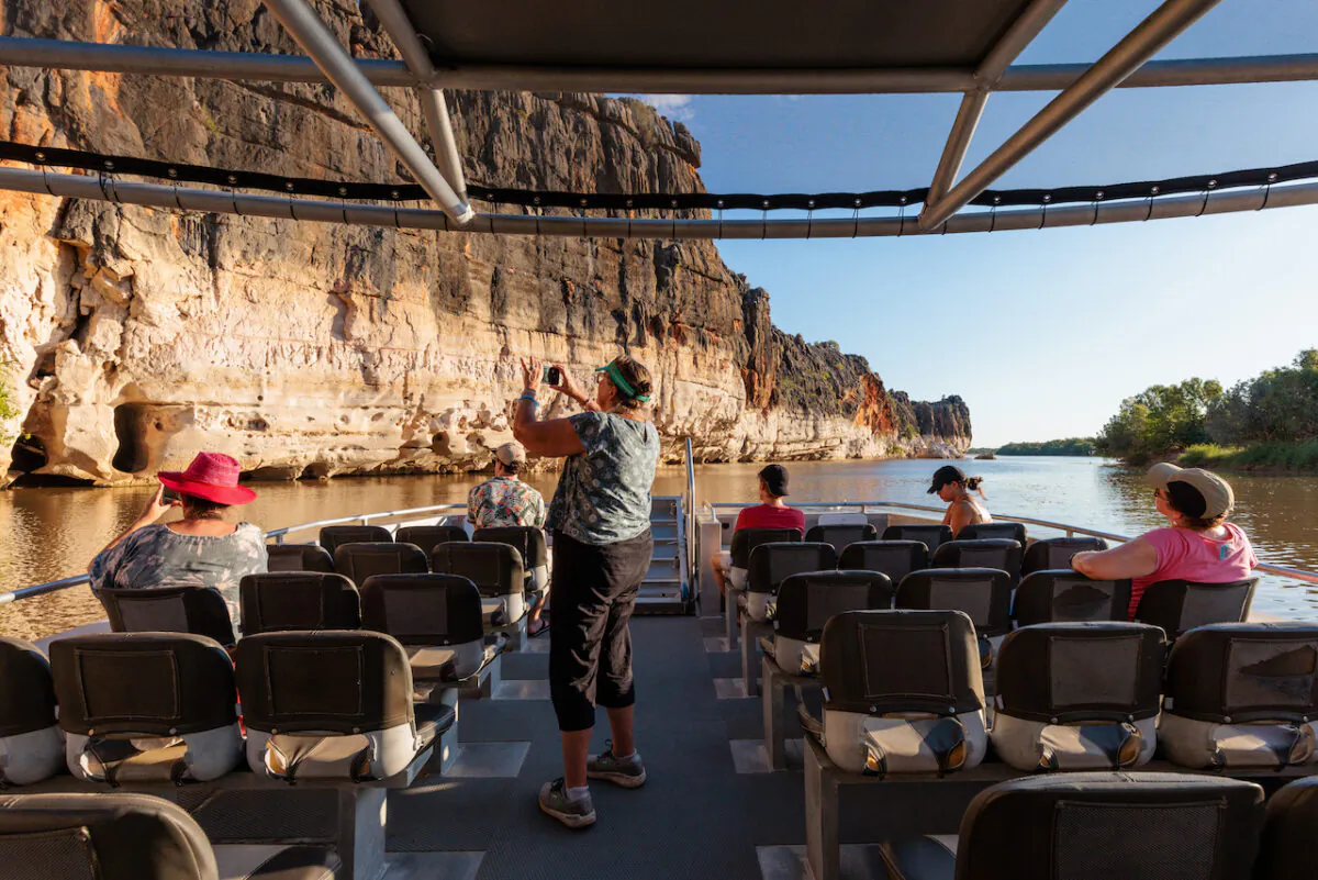 Tourists are seen on a boat trip to see the Danggu Geikie Gorge National Park, on the Fitzroy River near Fitzroy Crossing in the Kimberley region of Western Australia, Oct. 15, 2022. ( AAP Image/Richard Wainwright) 