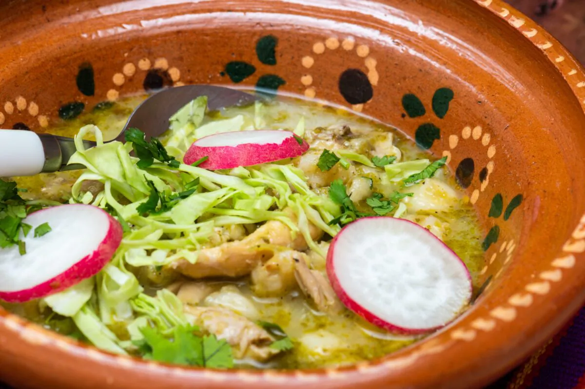 This Chicken Pozole Verde derives its flavor from poultry that's been simmered in a tangy sauce made from tomatillos, cilantro, and green chilies. (Dreamstime/TNS)