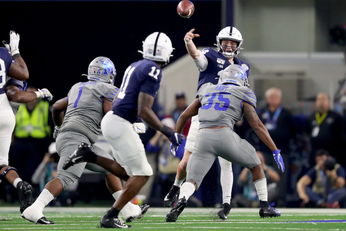Sean Clifford (14) of the Penn State Nittany Lions looks for an open receiver against the Memphis Tigers in the second half of the Goodyear Cotton Bowl Classic at AT&T Stadium in Arlington, Texas, on Dec. 28, 2019. (Tom Pennington/Getty Images)