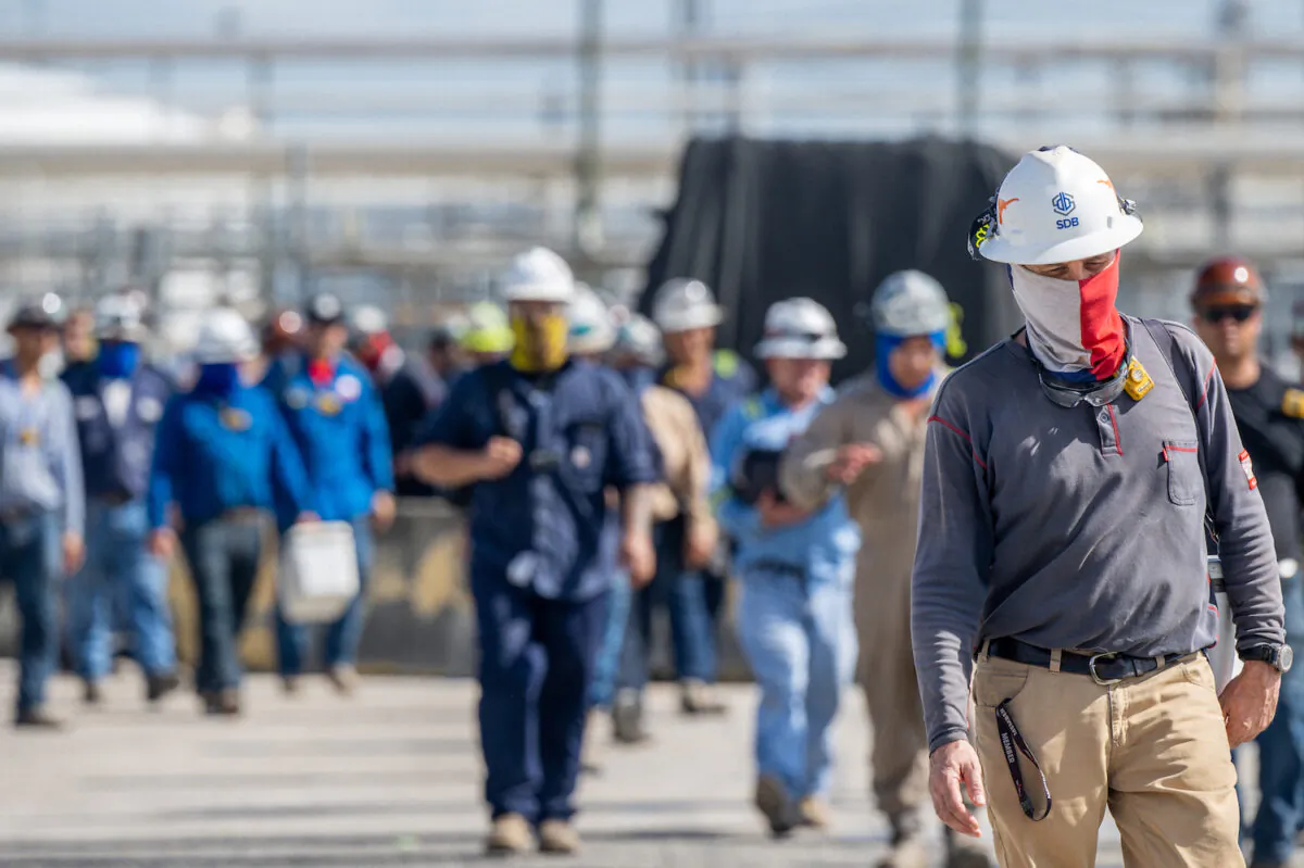 Workers exit the Marathon Galveston Bay Refinery in Texas City, Texas on May 10, 2022. (Brandon Bell/Getty Images)