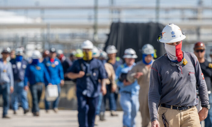 Workers exit the Marathon Galveston Bay Refinery in Texas City, Texas, on May 10, 2022. (Brandon Bell/Getty Images)