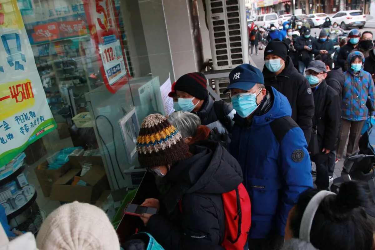 People queue to buy medicine at a pharmacy amid the COVID-19 pandemic in Nanjing, in China's eastern Jiangsu Province on Dec. 20, 2022. (STR/AFP via Getty Images)