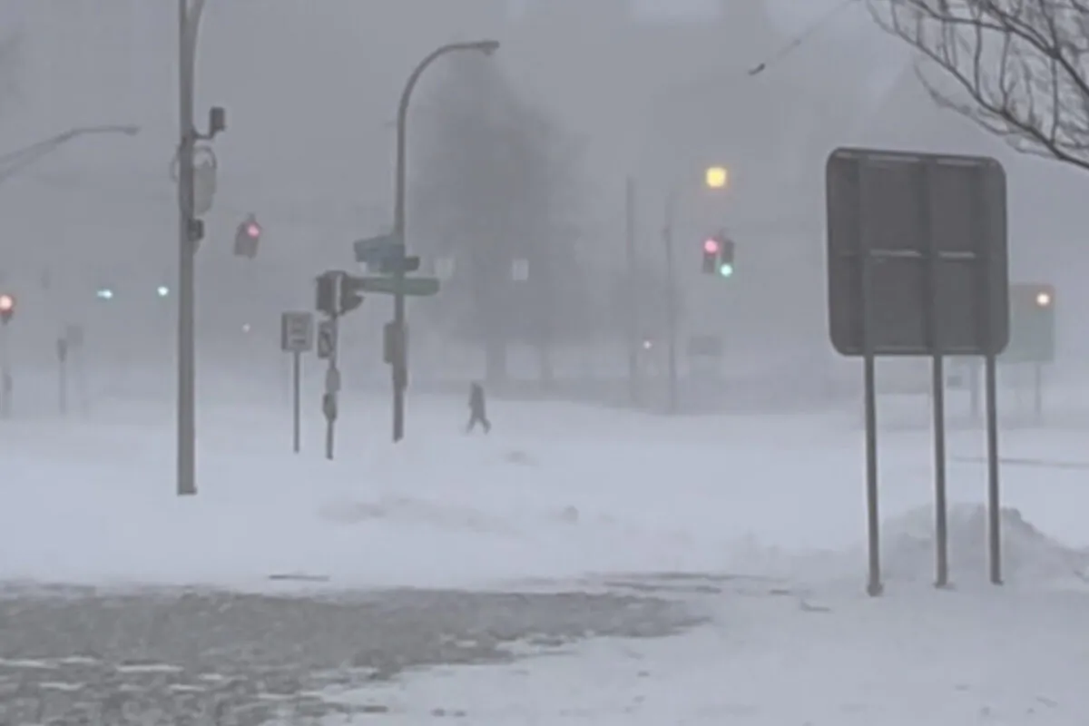 High winds and snow covers the streets and vehicles in Buffalo, N.Y., on Dec. 25, 2022. (WKBW via AP)