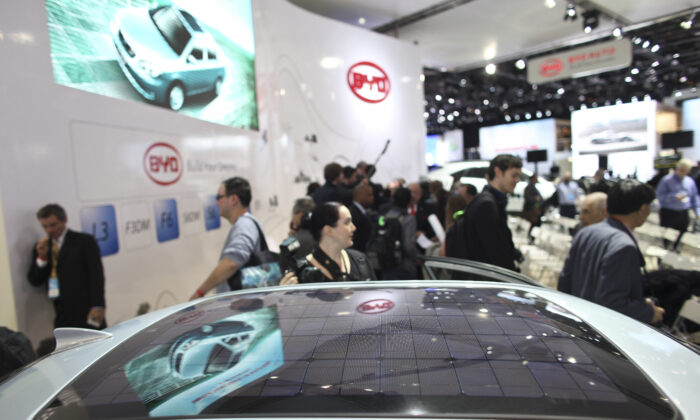 A solar panel is integrated into Chinese automaker BYD's F3BD, a hybrid vehicle at the company's display at the North American International Auto Show in Detroit, Michigan, on Jan. 10, 2011. (Geoff Robins/AFP via Getty Images)