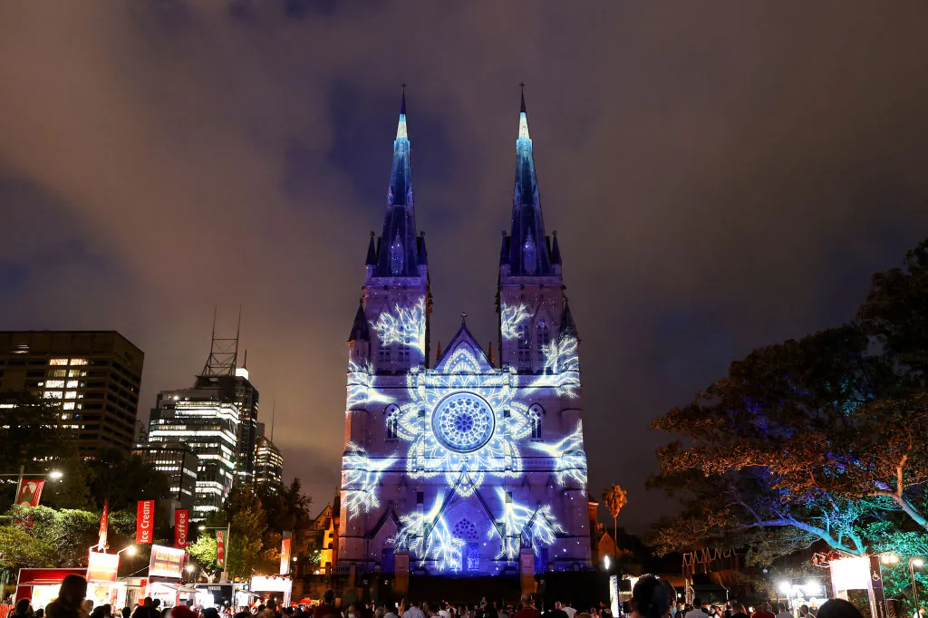 St Mary's Cathedral is illuminated with Christmas themed projections in celebration of Christmas on December 21, 2021 in Sydney, Australia. (Photo by Brendon Thorne/Getty Images)