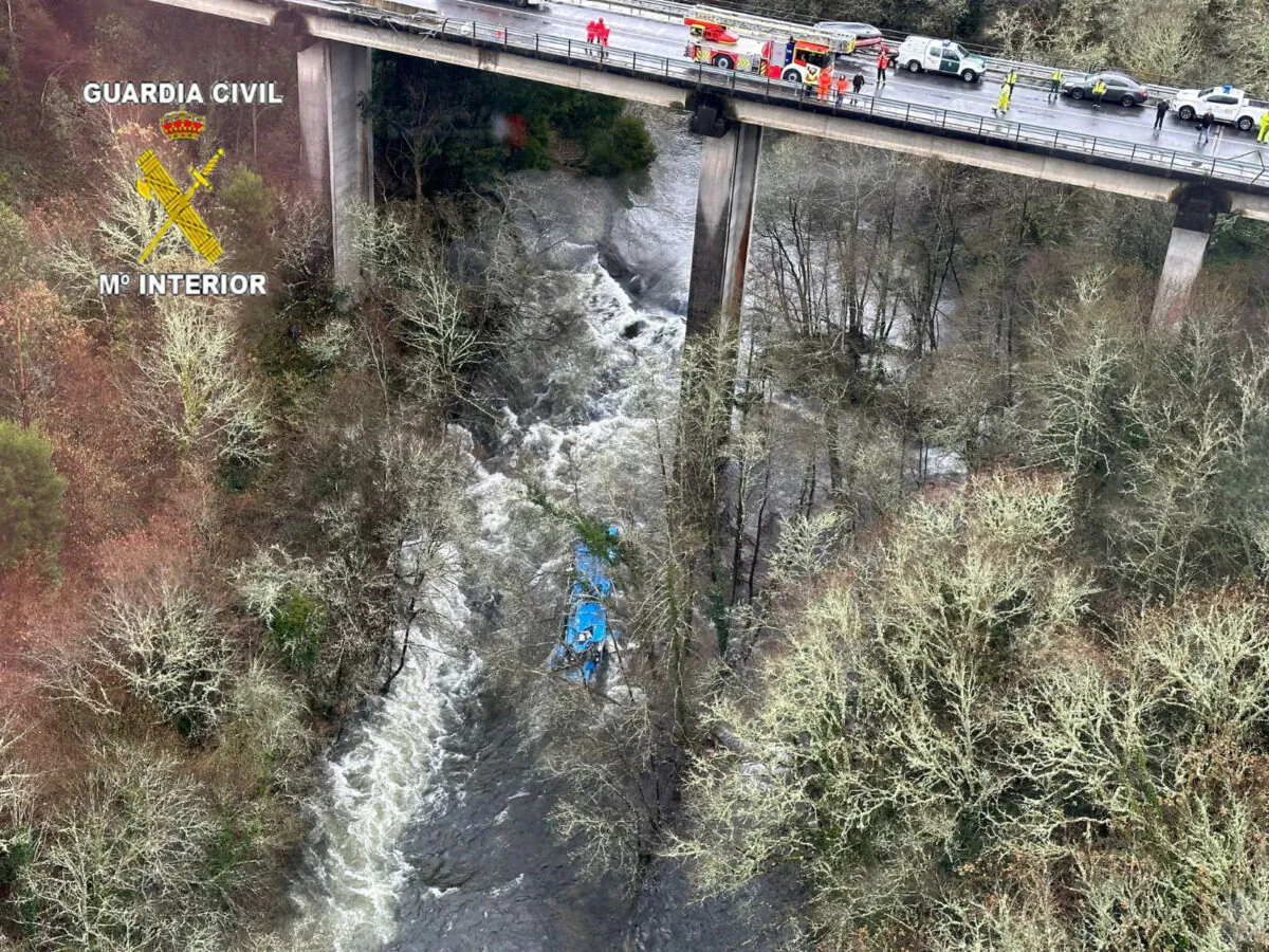 Emergency services work at the scene of an accident where a passenger bus plunged off a bridge into the river Lerez in Cerdedo-Cotobade, northwestern Spain, on Dec. 25, 2022. (Guardia Civil/Handout via Reuters)