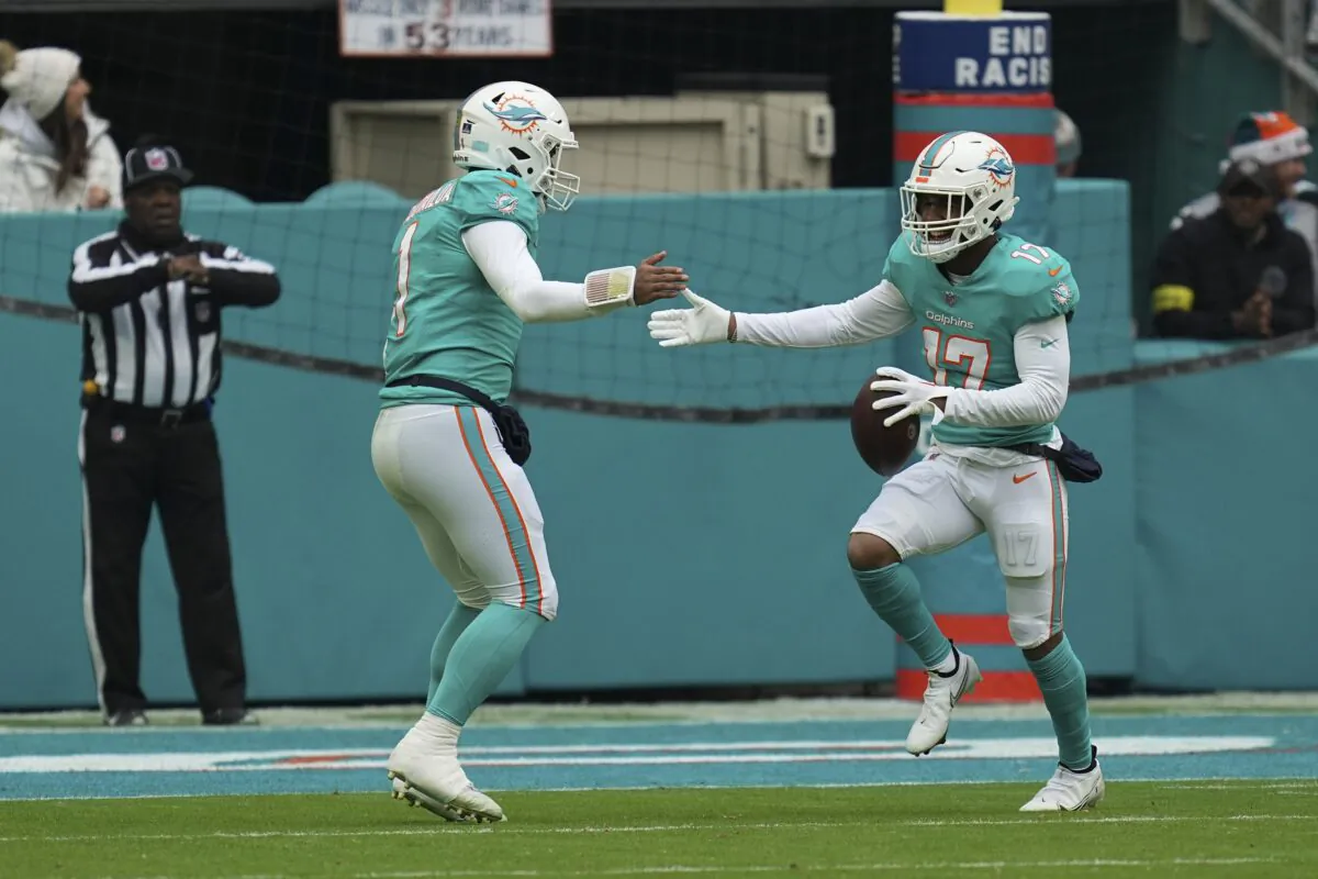Miami Dolphins wide receiver Jaylen Waddle (17) (R) celebrates with Miami Dolphins quarterback Tua Tagovailoa (1) after scoring a touchdown during the first half of an NFL football game in Miami Gardens, Fla., on Dec. 25, 2022. (Jim Rassol/AP Photo)