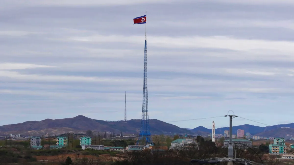 A North Korean flag flutters in the wind atop a 160-meter tower in North Korea's village Gijungdongseen, as seen from the Taesungdong freedom village inside the demilitarized zone in Paju, South Korea, on April 27, 2018. (Lee Jin-man via AP)