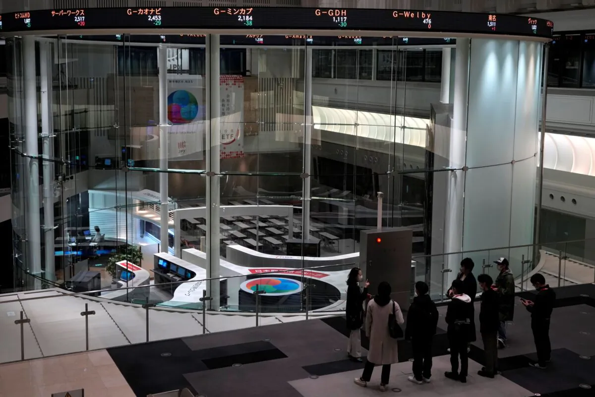 Visitors are seen at the Tokyo Stock Exchange in Tokyo, Japan, on Dec. 12, 2022. (Shuji Kajiyama/AP Photo)