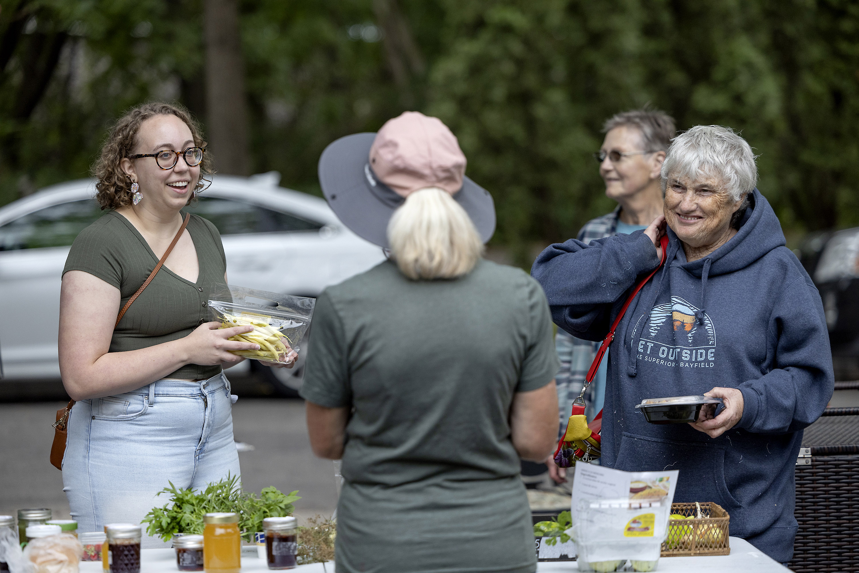 Betty Lotterman tends to a line of people who stopped by to buy her vegetables, baked goods and jellies 