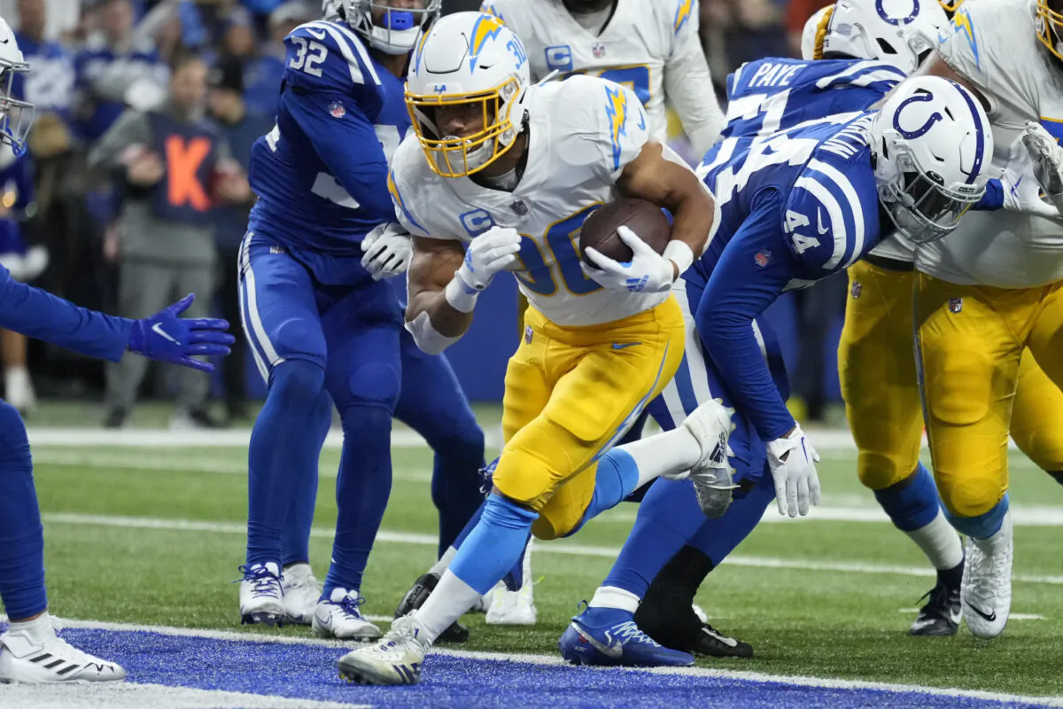 Los Angeles Chargers' Austin Ekeler (30) runs in for a touchdown during the first half of an NFL football game against the Indianapolis Colts in Indianapolis on Dec. 26, 2022. (AJ Mast/AP Photo)