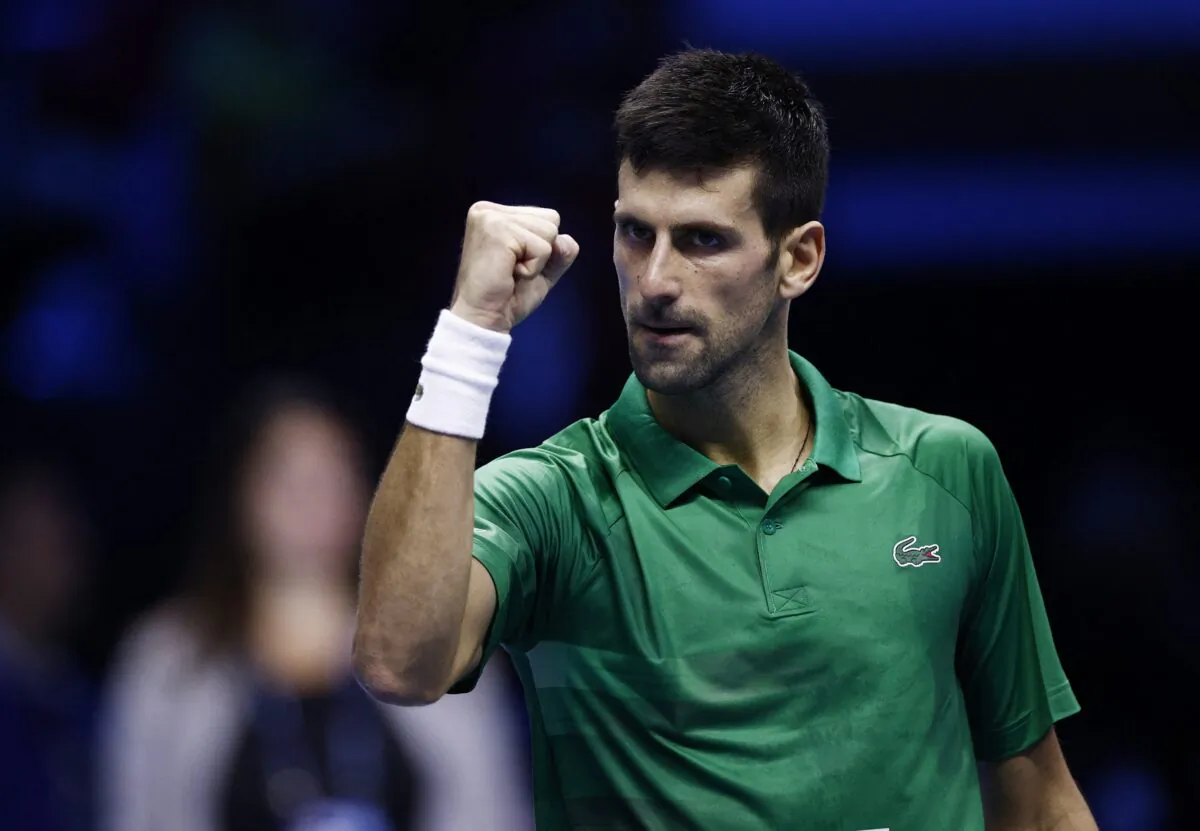 Serbia's Novak Djokovic celebrates after winning his group stage match against Russia's Daniil Medvedev during ATP Finals at Pala Alpitour in Turin, Italy, on Nov. 18, 2022. (Guglielmo Mangiapane/Reuters)