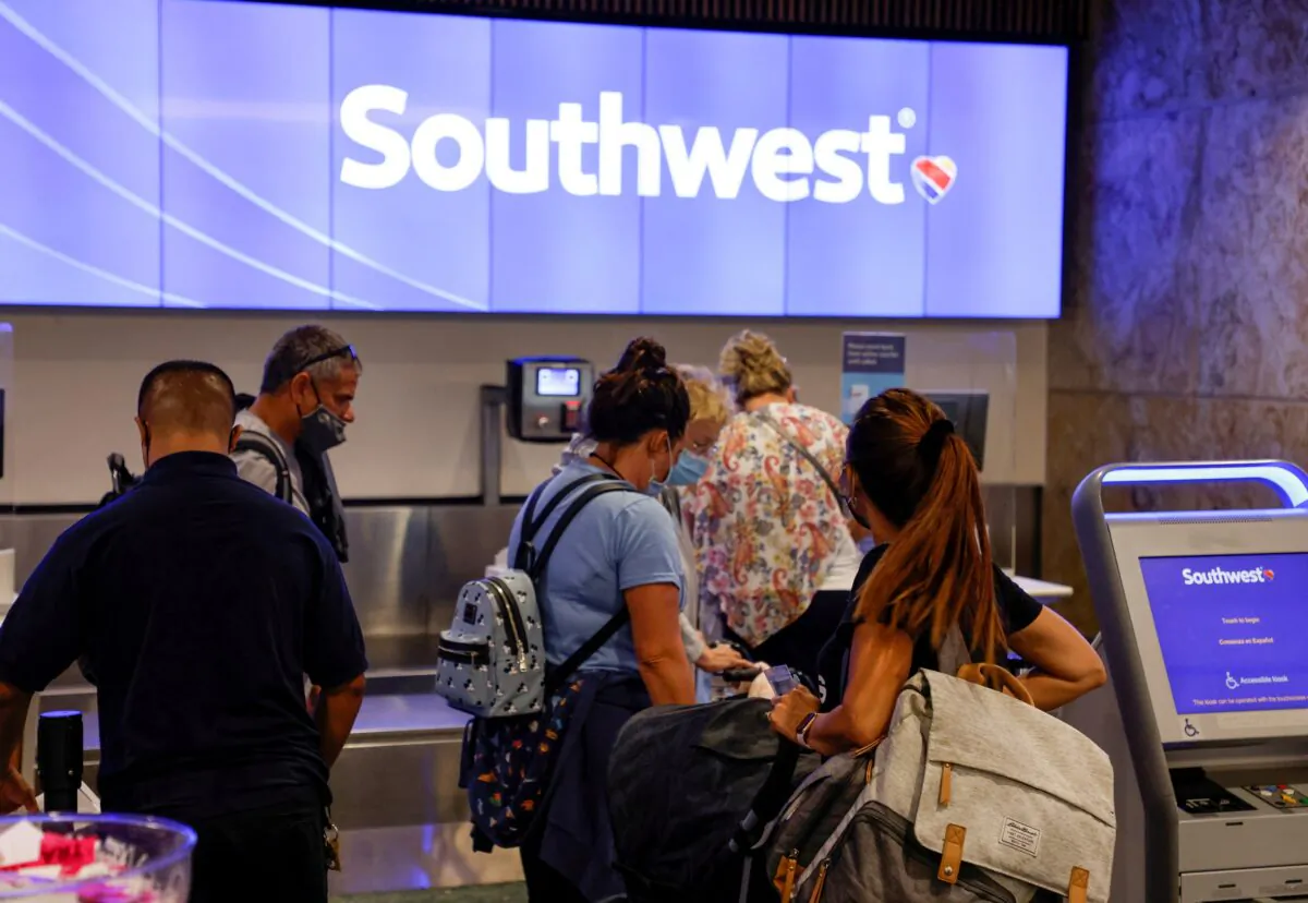 Passengers check in for a Southwest Airlines flight at Orlando International Airport in Orlando, Fla., on Oct. 11, 2021. (Joe Skipper/Reuters)