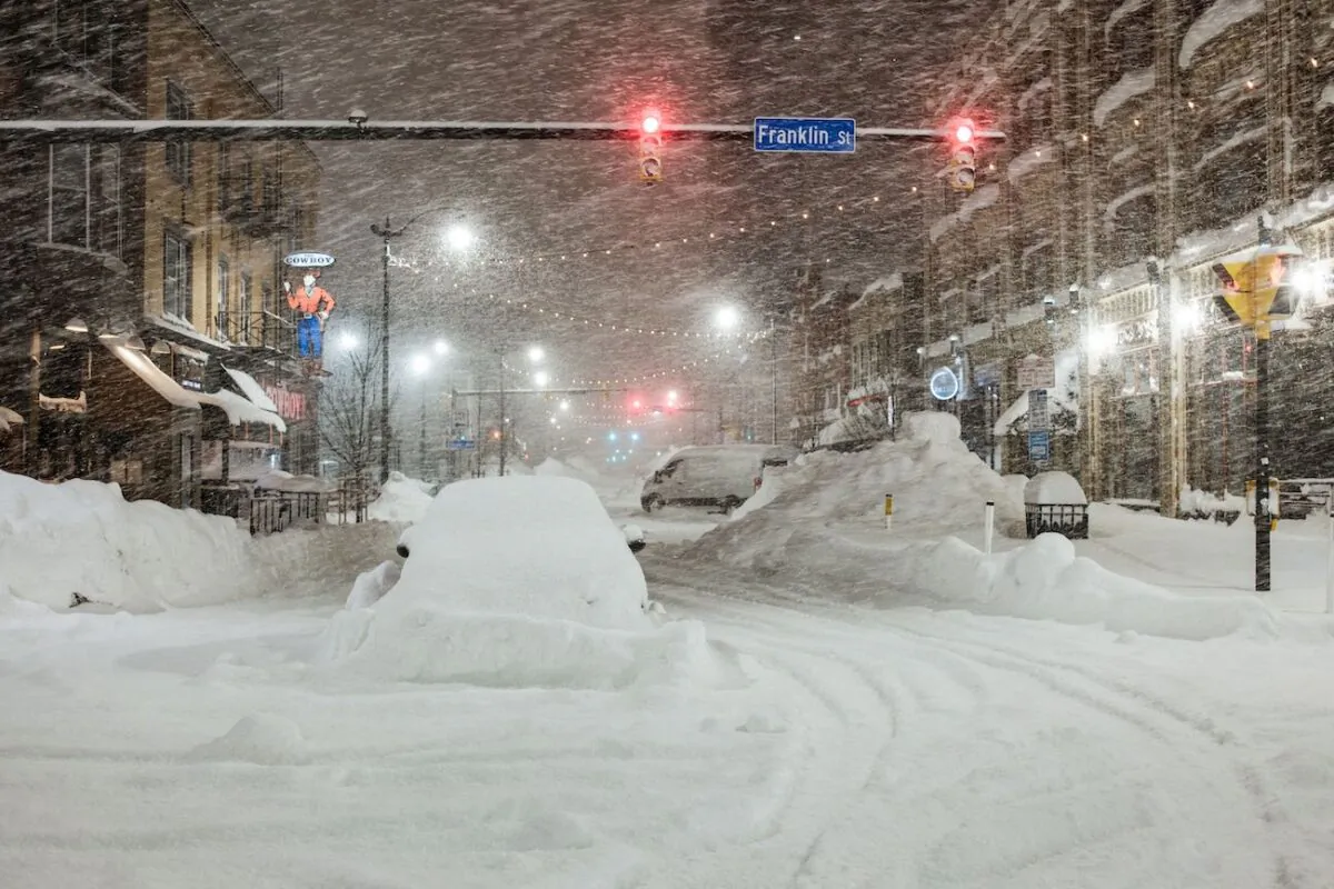 Vehicles are seen abandoned in heavy snowfall in downtown Buffalo, New York, on Dec. 26, 2022. (Joed Viera/AFP via Getty Images)