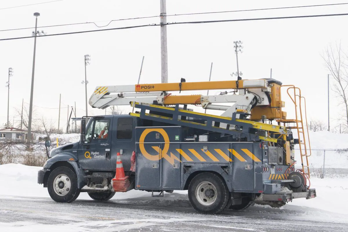A Hydro Quebec truck is shown in an area without power in Montreal on Dec. 24, 2022. (Graham Hughes/The Canadian Press)