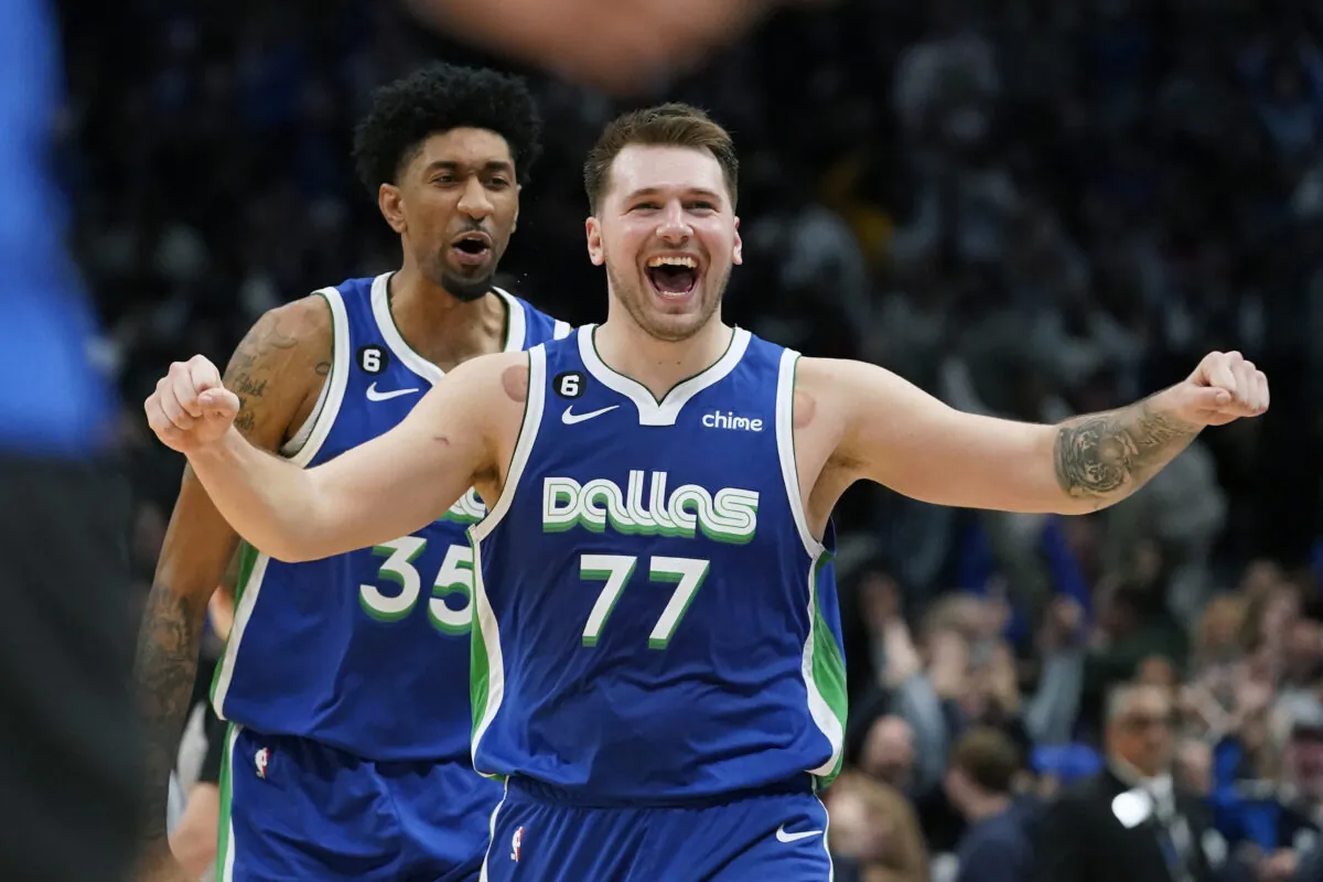 Dallas Mavericks guard Luka Doncic (77) celebrates scoring the game tying basket in front of teammate Christian Wood (35) during the fourth quarter of an NBA basketball game against the New York Knicks in Dallas on Dec. 27, 2022. (LM Otero/AP Photo)