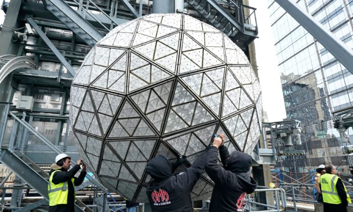 Workers instal  immoderate   of the 192 sparkling caller   Waterford Crystal Triangles connected  the Times Square New Year's Eve Ball atop the extortion   of One Times Square successful  New York connected  Dec. 27, 2022.(Timothy A. Clary/AFP via Getty Images)