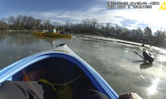 Rescuers Use Kayaks to Reach Pilot After Crash in Icy Creek