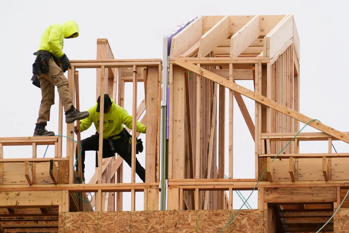 Construction workers build new homes in Philadelphia on April 5, 2022. (Matt Rourke/AP Photo)