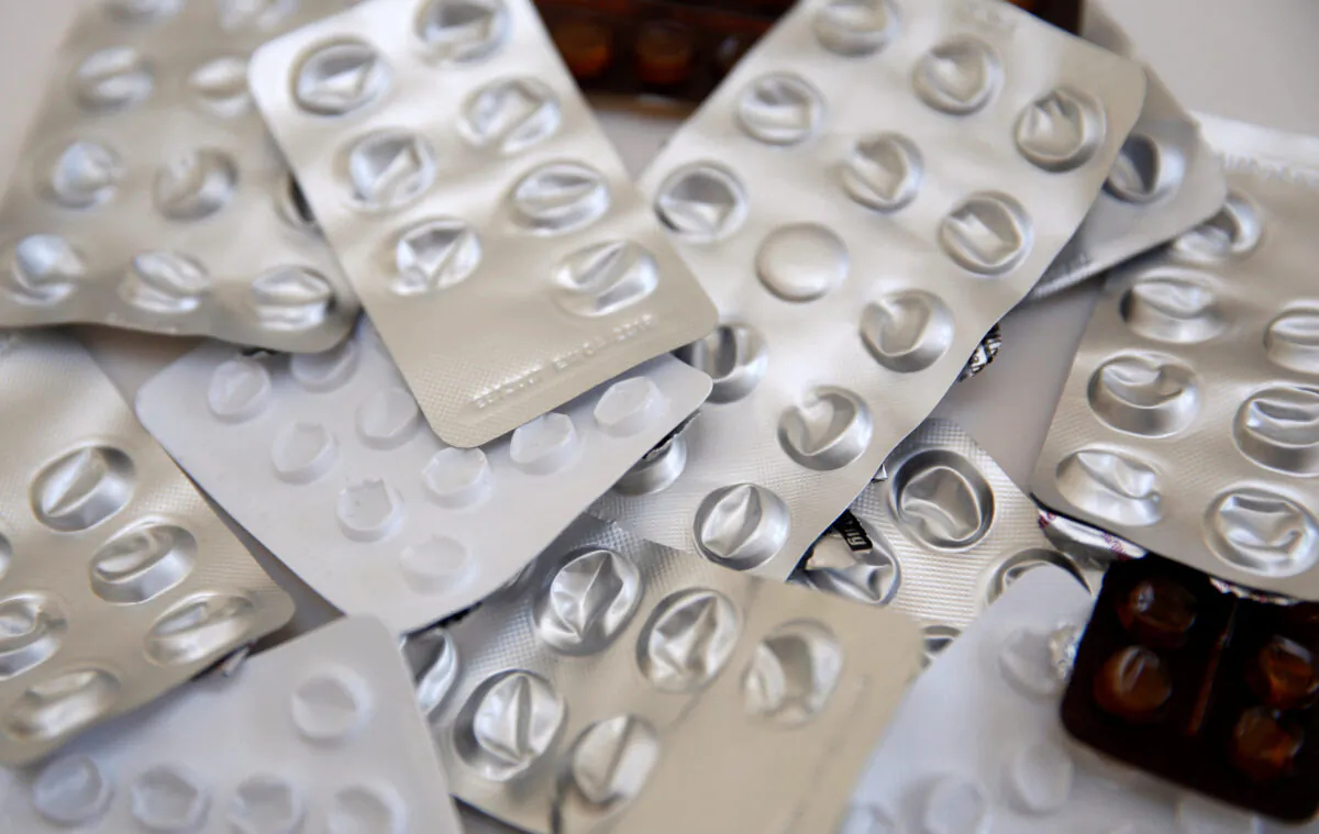 An illustration of used blister packets containing medicines, tablets, and pills. (Russell Boyce/Illustration/Reuters)
