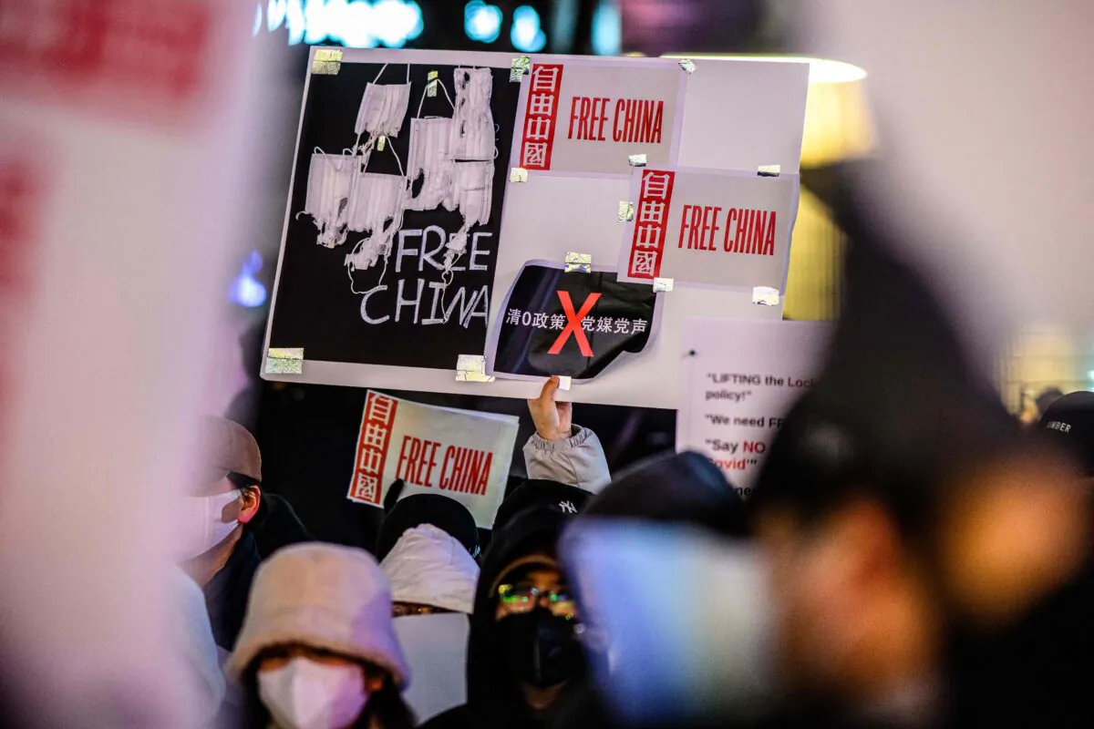 A group of protesters hold a gathering in support of demonstrations held in China over Beijing's COVID-19 restrictions, in Seoul, South Korea, on Nov. 30, 2022. (Anthony Wallace/AFP via Getty Images)