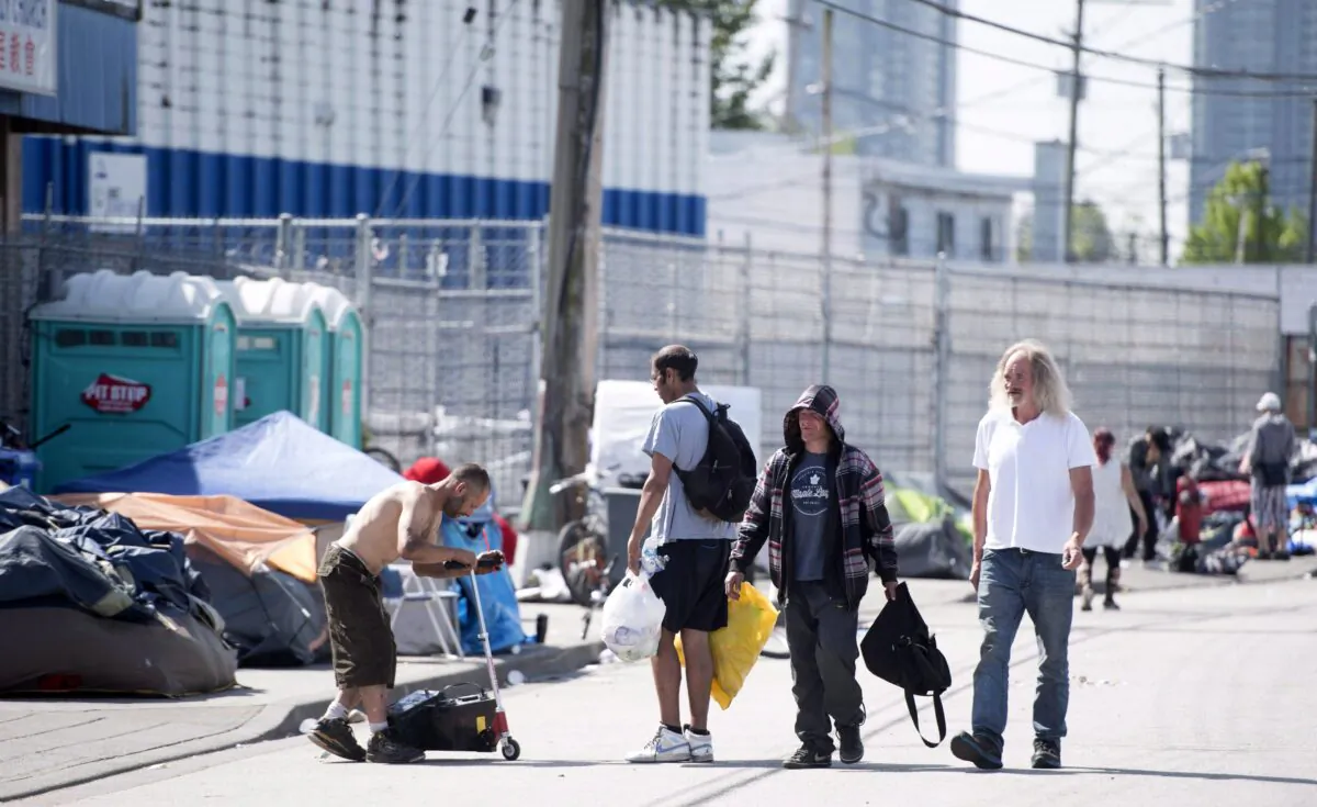 A tent city is seen outside the newly opened Fraser Health supervised drug consumption site in Surrey, B.C., on June 6, 2017. (The Canadian Press/Jonathan Hayward)