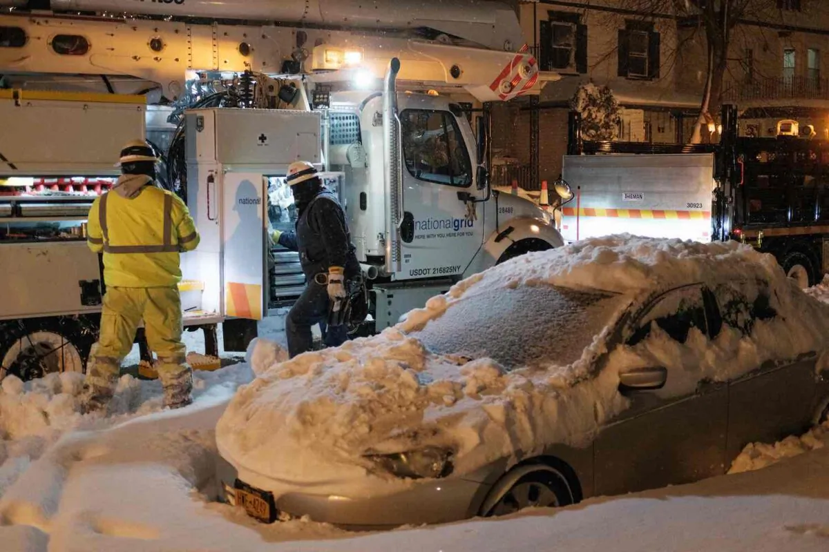 National Grid technicians work in Buffalo, N.Y, on Dec. 26, 2022. (Joed Viera/AFP via Getty Images)