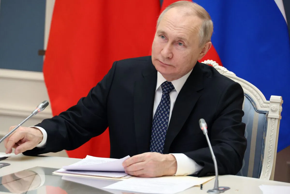 Russian President Vladimir Putin holds a meeting with Chinese President Xi Jinping via a video link at the Kremlin in Moscow on Dec. 30, 2022. (Mikhail Klimentyev/SPUTNIK/AFP via Getty Images)