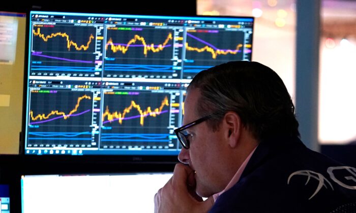 A trader reacts on the floor of the New York Stock Exchange at the closing bell in New York City, on Dec. 30, 2022. (Timothy A. Clary/AFP via Getty Images)