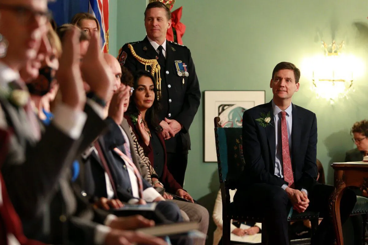 Premier David Eby looks on as ministers are sworn in during a ceremony at Government House in Victoria, B.C., Dec. 7, 2022. (The Canadian Press/Chad Hipolito)
