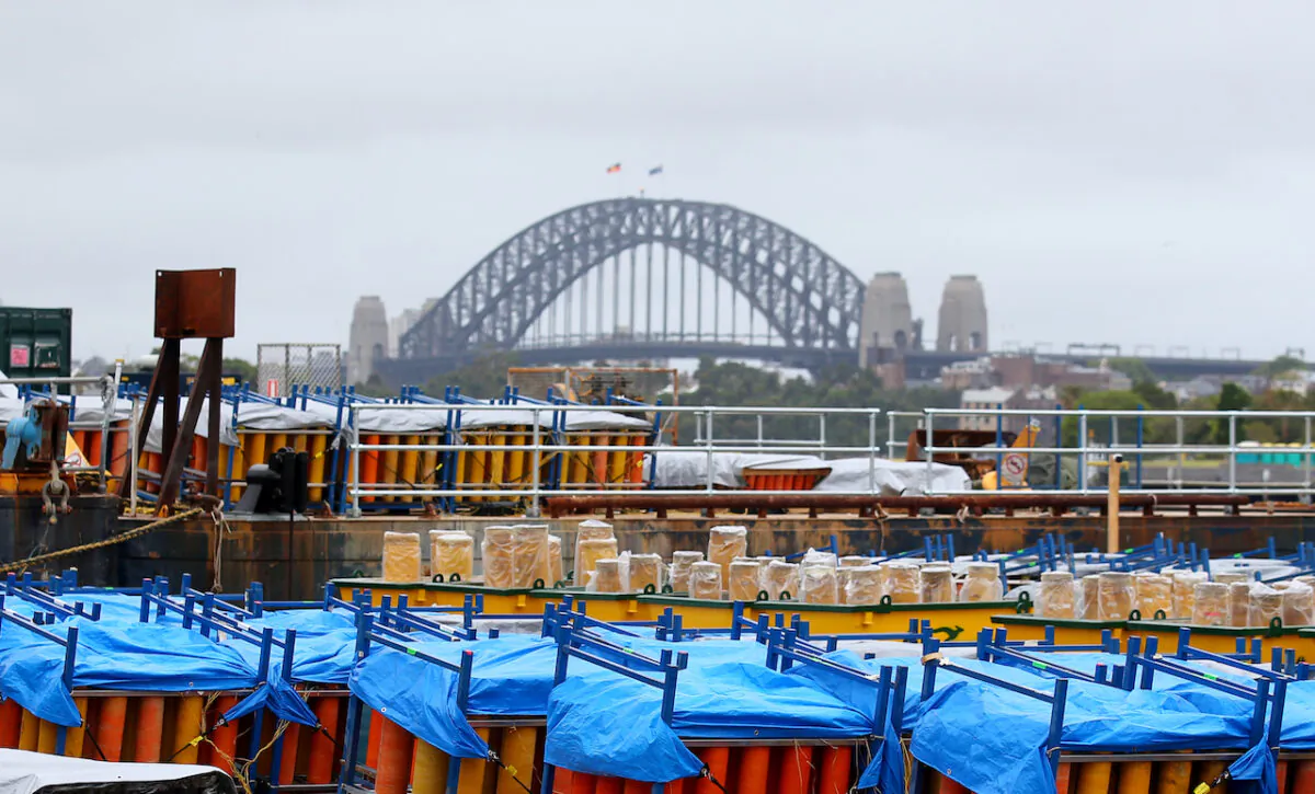New Year’s Eve Fireworks are loaded onto barges ahead of Sydney New Year’s Eve 2022/23 celebrations on Glebe Island in Sydney, on Dec. 29, 2022. (AAP Image/Nikki Short)