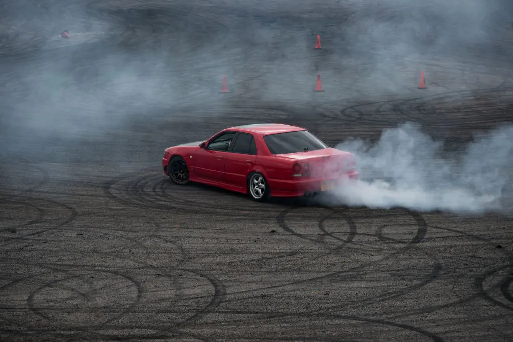A car demonstrates “drifting.” (OLI SCARFF/AFP via Getty Images)