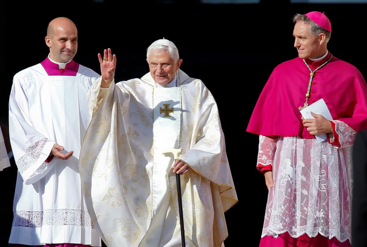 Emeritus Pope Benedict XVI waves as he arrives to attend a mass for the beatification of former pope Paul VI in St. Peter's square at the Vatican, on Oct. 19, 2014. (Tony Gentile/Reuters)