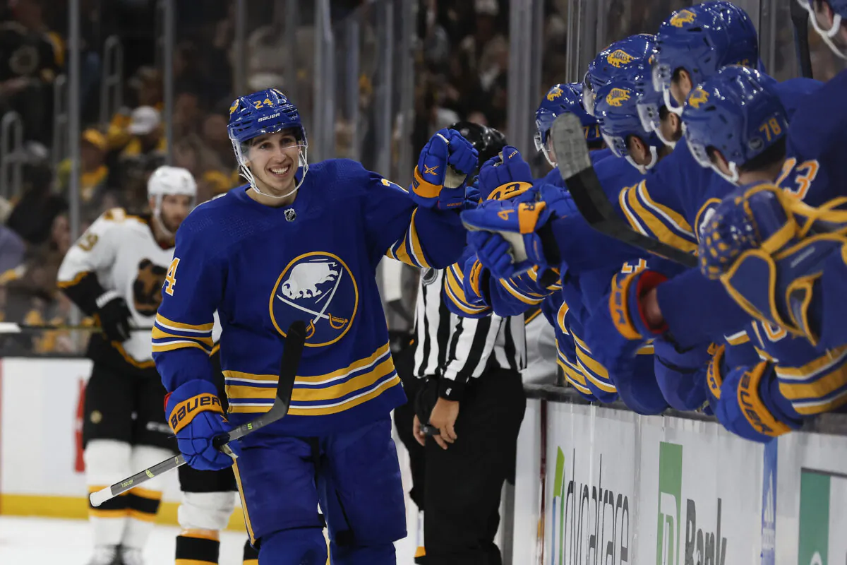 Buffalo Sabres center Dylan Cozens (24) is congratulated at the bench after his game tying goal against the Boston Bruins during the third period at TD Garden in Boston on Dec. 31, 2022. (Winslow Townson/USA TODAY Sports via Reuters)