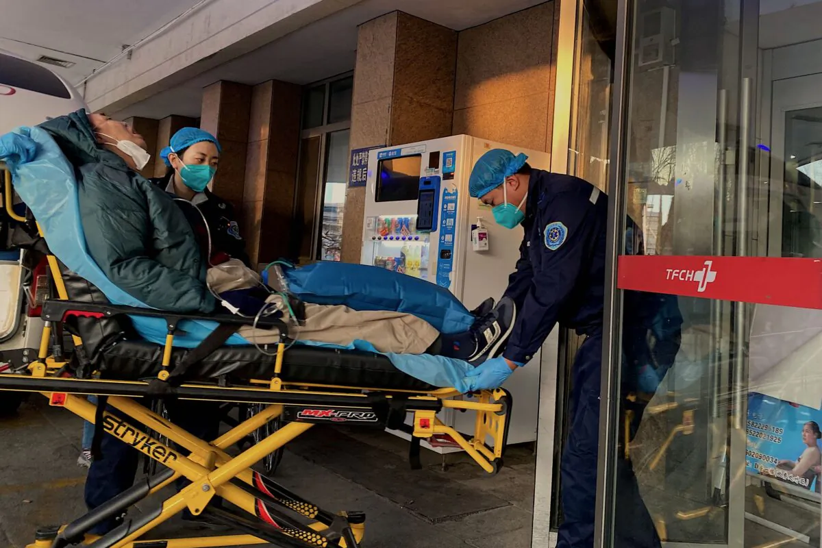 Health workers move a COVID-19 patient at Tianjin First Center Hospital in Tianjin, China, on Dec. 28, 2022.(Noel Cells /AFP via Getty Images)