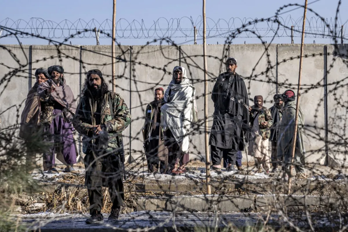 Taliban terrorists check the site of an explosion near the Interior Ministry, in Kabul, Afghanistan, on Jan. 1, 2023. (Ebrahim Noroozi/AP Photo)