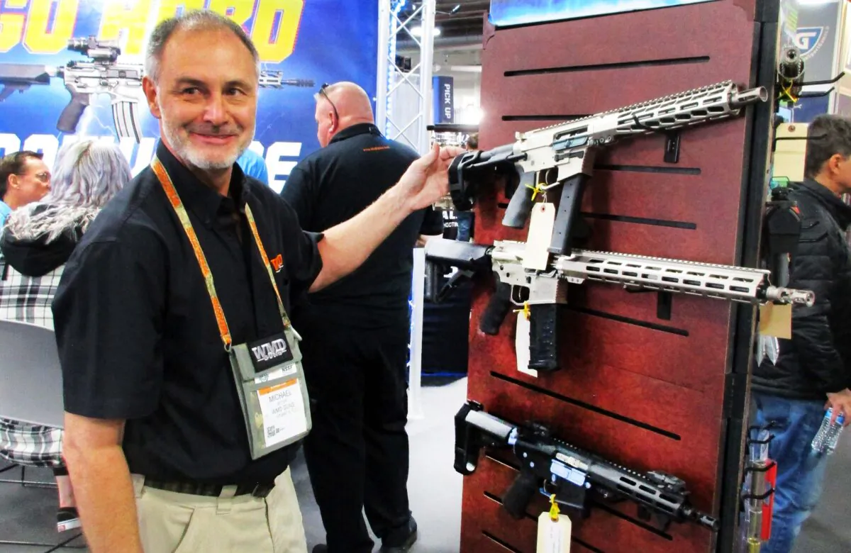 Michael Vetter of WMD Guns in Stuart, Fla., displays some of the firearms his company offers that come equipped with pistol stabilizing braces during the 2023 SHOT Show in Las Vegas, Nev.  (Michael Clements/The Epoch Times)