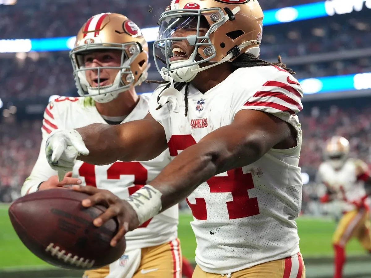San Francisco 49ers running back Jordan Mason (24) celebrates with San Francisco 49ers quarterback Brock Purdy (13) after scoring a touchdown against the Las Vegas Raiders during the second half at Allegiant Stadium in Paradise, Nev., on Jan. 1, 2023. (Stephen R. Sylvanie/USA TODAY Sports via Field Level Sports)