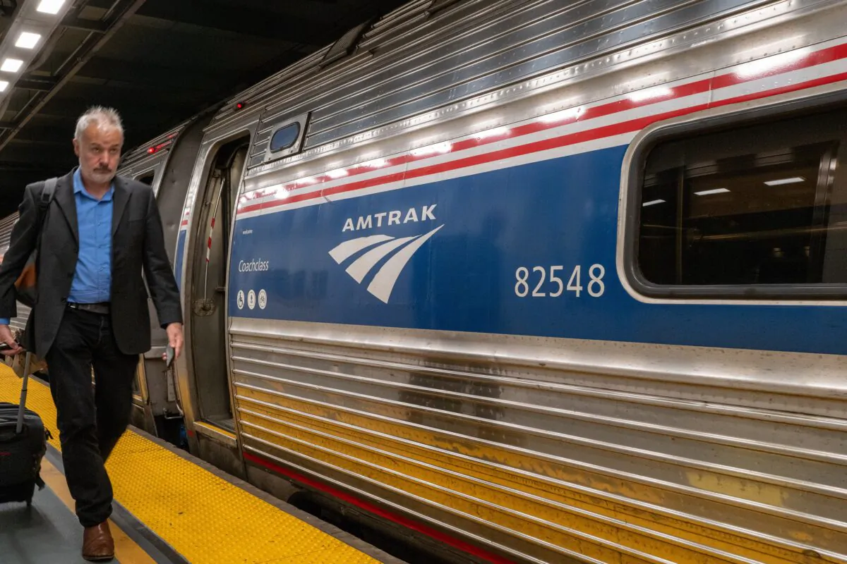 A man walks to an Amtrak train in the Moynihan Train Hall in New York on Sept. 15, 2022. (Spencer Platt/Getty Images)