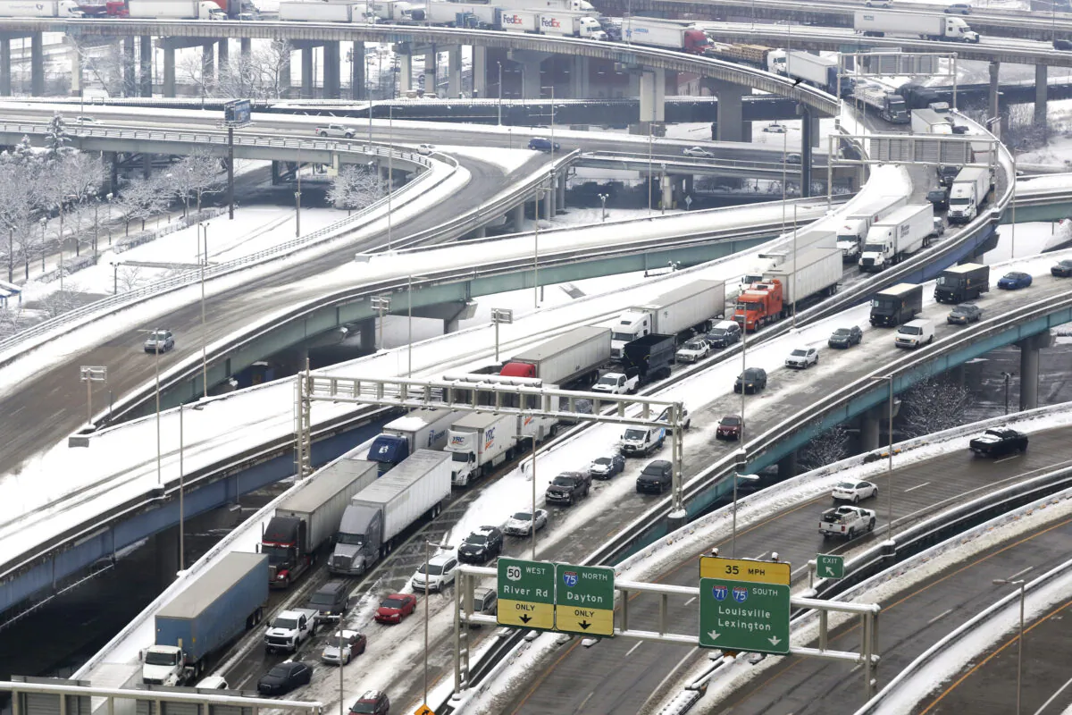 Vehicles are at a standstill as they exit the Brent Spence Bridge near downtown Cincinnati on Feb. 9, 2021. (Cara Owsley/The Cincinnati Enquirer via AP, File)