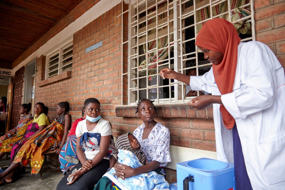 Patients and a clinician at Ndirande Health Centre in Blantyre, Malawi, on Nov. 16, 2022. (Eldson Chagara/Reuters)