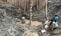 Rescuers in Vietnam Try to Save Boy Trapped in Concrete Pile