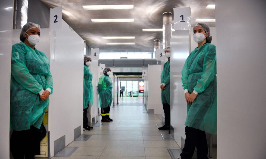 Medical staff at the COVID-19 testing center of the Paris-Charles-de-Gaulle airport wait for travelers from China, outside Paris on Jan. 1, 2023. (JULIEN DE ROSA/AFP via Getty Images)