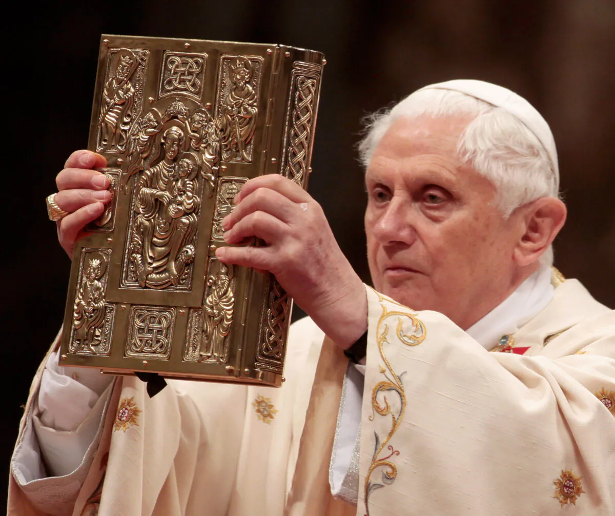 Pope Benedict XVI holds the Book of the Gospels during the Easter vigil mass in St. Peter's Basilica, in Vatican City, Vatican, on April 3, 2010. (Elisabetta Villa/Getty Images)