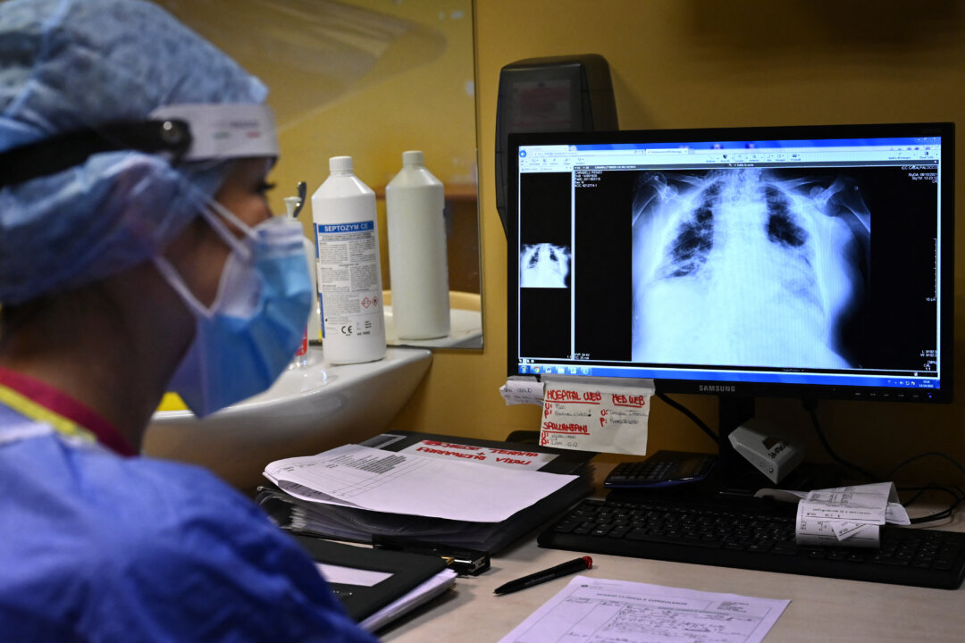 A nurse Nurse views the lung x-rays of a COVID-19 patient at the Casalpalocco hospital, south of Rome, Italy, on Oct. 13, 2021. (Alberto Pizzoli/AFP via Getty Images)