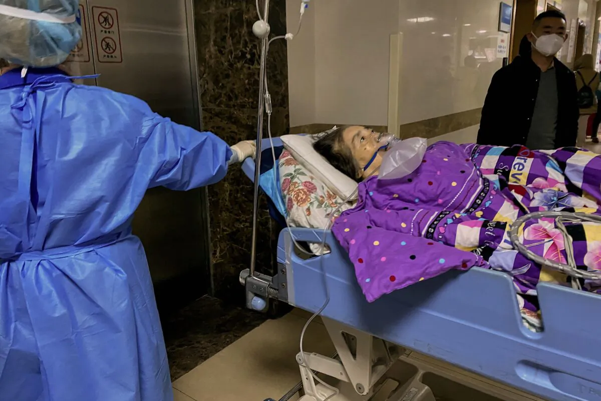 A COVID-19 patient on a stretcher in the emergency ward of the First Affiliated Hospital of Chongqing Medical University, in China's southwestern city of Chongqing, on Dec. 22, 2022. (Noel Celis/AFP via Getty Images)