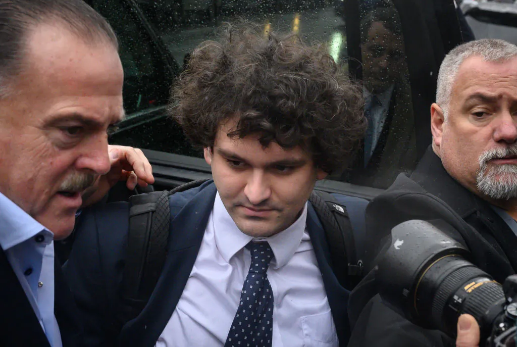 Former FTX chief executive Sam Bankman-Fried (C) arrives to enter a plea before US District Judge Lewis Kaplan in the Manhattan federal court, in New York, on Jan. 3, 2023. (Photo by Ed Jones/AFP via Getty Images)