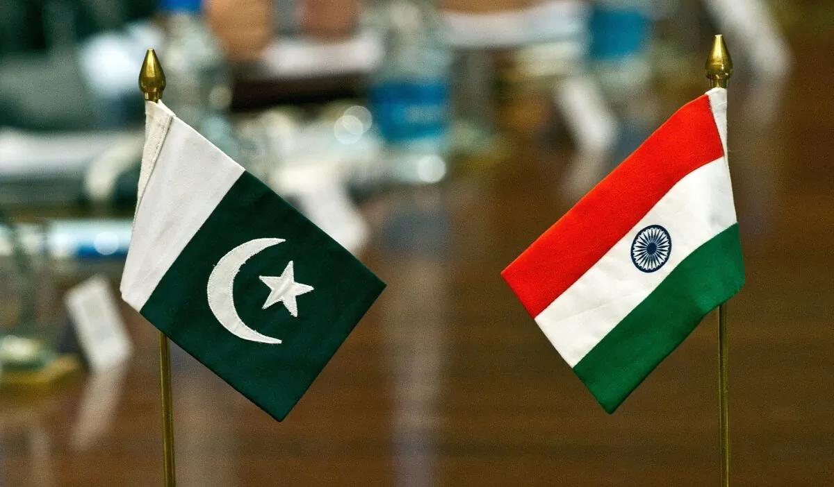 Pakistani (L) and Indian flags stand on a table during an Indian-Pakistan meeting on the Sir Creek region in New Delhi, India, on June 18, 2012. (Prakash Singh/AFP/GettyImages)