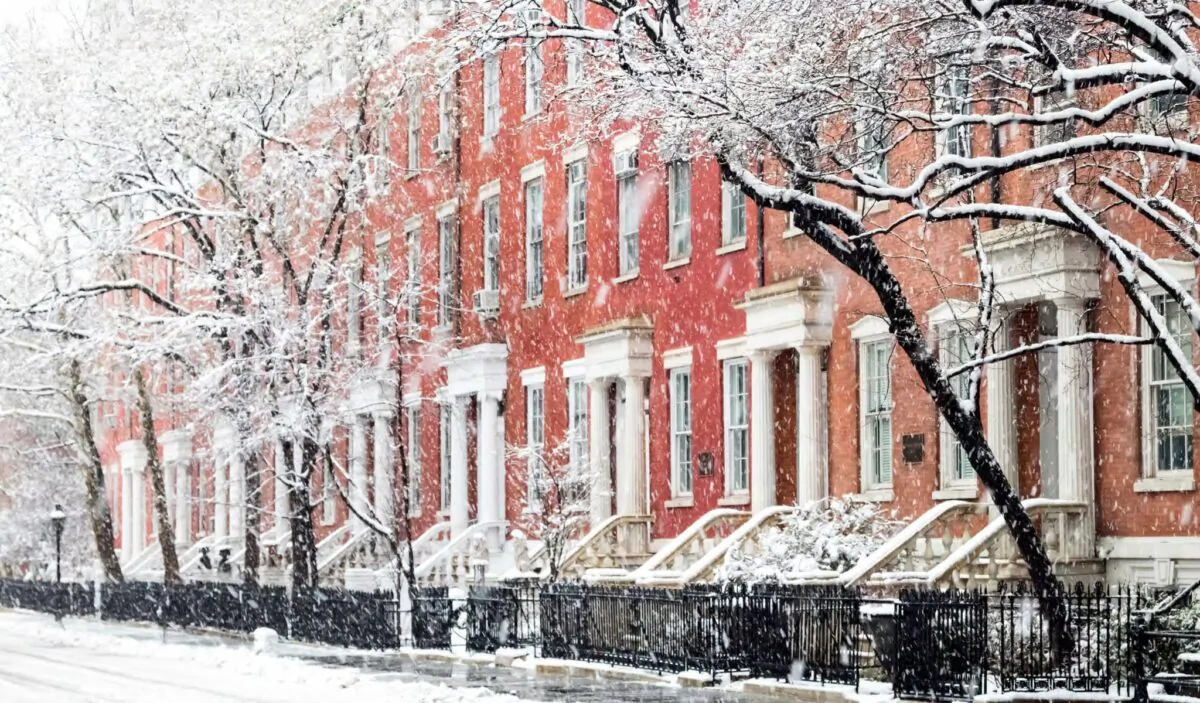 Snowy winter street scene with historic buildings along Washington Square Park in Manhattan, New York City, N.Y. (Ryan DeBerardinis/Shutterstock)